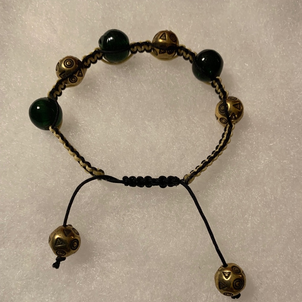 Handmade and crafted Black Beaded Shamballa Bracelet with gold and white cord.